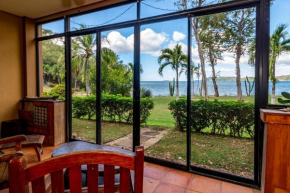 Warm interiors and orange hues on ground floor in front of beach in Flamingo